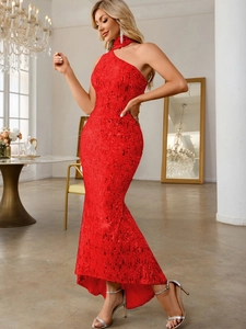 Detailed close-up of the red sequin fishtail evening dress showing the high-quality fabric