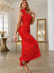 Detailed view of luxury red sequin fabric and elegant one-shoulder fishtail evening gown