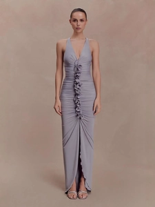 Elegant lavender ruched maxi dress with deep V-neck, rosette details, and a slim-fit silhouette