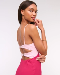 Detailed back view of backless pink colorblock maxi dress with stylish metal hardware