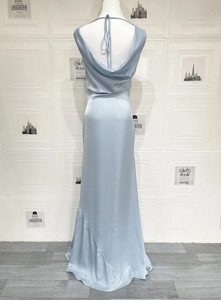 Detail view of light blue satin formal dress featuring elegant cowl back and lace-up design