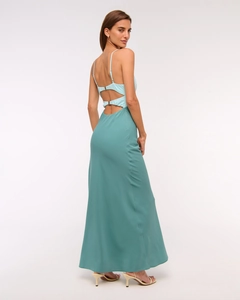 Close-up of the open-back design with buckle and blue-green color block dress