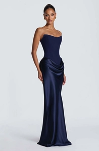 Detail of navy blue strapless satin gown featuring corset bodice and draped mermaid skirt