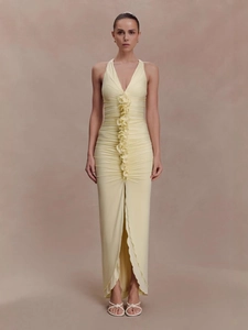 Elegant slim fit halter maxi dress in pale yellow with pleated textures and center ruffle