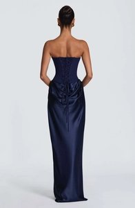 Detailed back view of a satin strapless gown featuring elegant lace-up cross ties and drapes