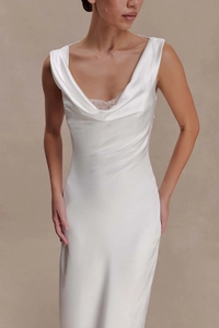Detailed view of cowl neck satin dress featuring delicate white lace trim and silky texture