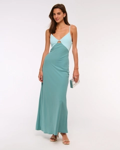Detail of color-block satin maxi dress with slim straps and chest cutout detail