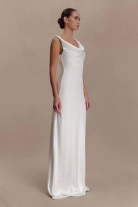 Detail view of white satin gown featuring a cowl neck and elegant fisheye draped skirt