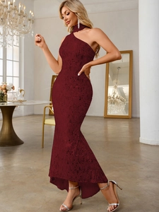 Detail of burgundy sequin fishtail dress featuring elegant halter neck and asymmetric hem