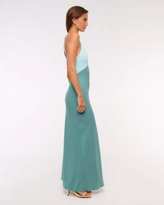 Detail of sleek satin two-tone backless maxi dress in light blue and deep teal shades