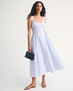 Detail of blue and white striped sleeveless dress with waist belt and flared hem