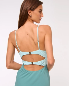Detail of sexy backless dress with double hollow design and gold metal buckles