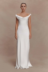Detailed view of white satin evening dress with elegant off-shoulder draped neckline