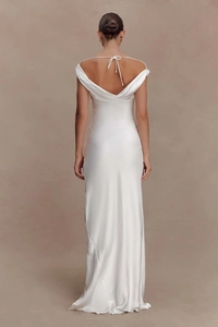 Detailed back view of white satin evening dress featuring cowl neck and backless design