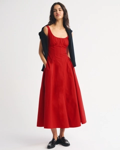 Front view of a red A-line maxi dress featuring a slim-fit bodice and flared skirt
