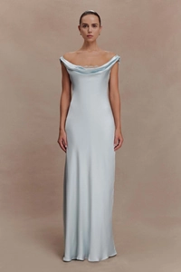 Close-up of elegant light blue satin gown with refined white lace trim on the cowl neckline