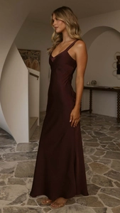 Close-up of elegant wine red satin dress featuring a V-neckline and fine shoulder straps