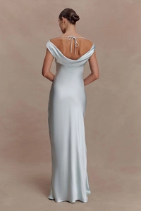 Detail of the ice blue satin evening dress featuring a backless design and tied spaghetti straps