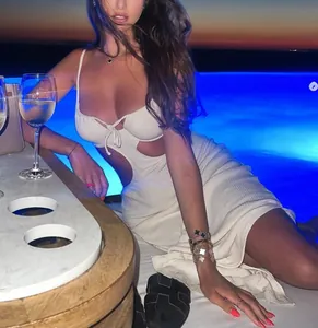 Detail of white ribbed knit dress with sexy cutout waist and drawstring bust design