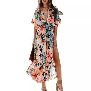 Floral V-neck maxi dress with ruffles, high side slit and abstract print in vibrant colors