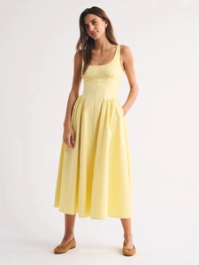 Pale yellow slim fit midi sundress with A-line skirt, square neck and side pockets