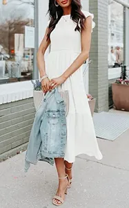 Detail of white tiered midi dress featuring ruffle cap sleeves and a round neckline