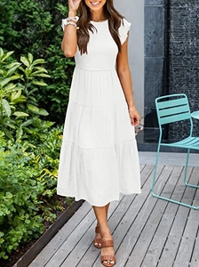 Detail of white tiered midi dress with ruffle cap sleeves and a tiered flowing skirt hem