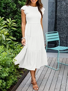Close-up of a white tiered dress with ruffle sleeves and high-quality summer fabric texture