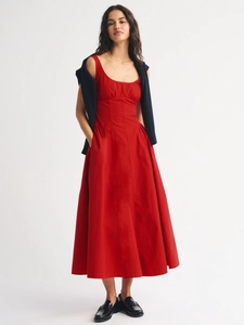 Sleeveless slim-fit red maxi dress with a-line silhouette and navy sweater accessory