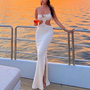 Elegant white ribbed knit maxi dress featuring waist cut-outs and a side slit for vacations