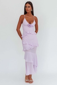 Close-up of lilac backless dress with 3D floral accent and layered ruffle details