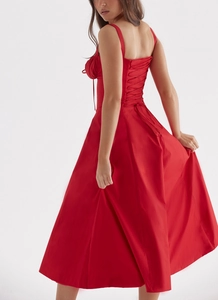 Detail of red floral maxi dress showing criss-cross lace-up back and cinched waist design