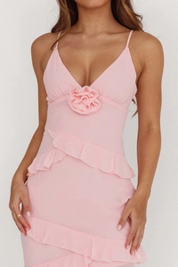 Close-up of pink strapless dress featuring 3D rose detail and ruffled layering