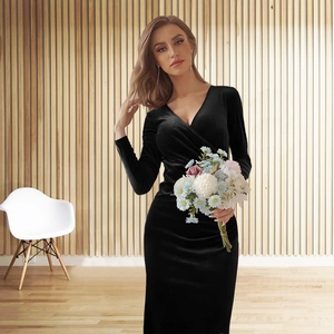 Detail of elegant V-neck velvet dress showing the wrap design and premium fabric texture