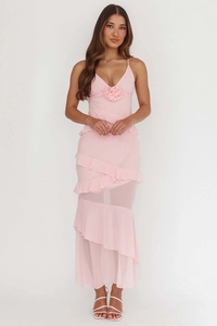 Detail of elegant backless pink maxi dress with tiered ruffles and 3D floral accents