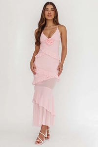 Detail of pink backless maxi dress with delicate ruffles and 3D floral accents