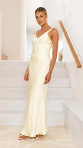 Close-up of champagne satin slip maxi dress with V-neckline and silky texture detail