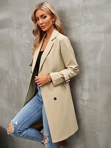 Classic double-breasted trench coat with notched lapels and stylish adjustable cuffs