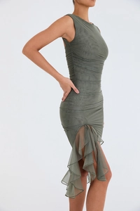 Detail of ruched olive green bodycon dress with layered ruffles and sheer mesh texture