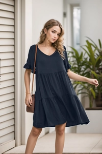 Detail of V-neck and tiered ruffled skirt on a navy blue summer mini dress for women