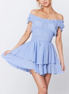Detailed view of light blue Swiss dot fabric with tiered ruffles and elastic waist