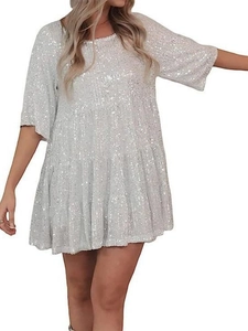 Detail of white sequin tiered mini dress showing the round neck and ruffled layers