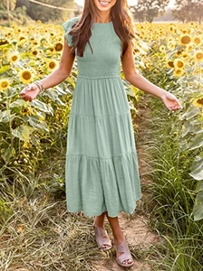 Detail of smocked bodice and ruffle sleeves on a sage green tiered summer midi dress