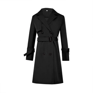 Detailed view of black double-breasted trench coat with classic lapels and adjustable waist belt
