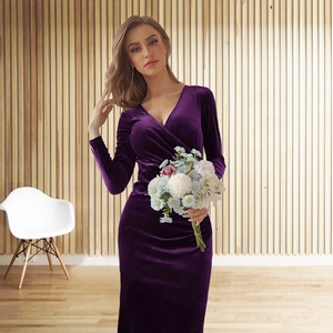 Detail of elegant V-neck velvet dress in deep purple with soft draped wrap styling