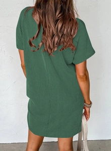 Detailed back view of dark green short sleeve dress with ribbed knit texture