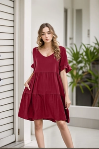 Deep red V-neck babydoll dress with tiered ruffle hem and short flutter sleeves detail