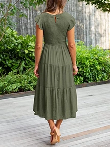 Detail view of the back of army green midi dress with smocked bodice and layered skirt