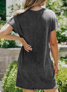 Detail of dark grey ribbed knit fabric and back view of a casual crew neck short sleeve dress