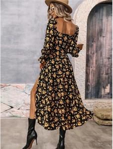 Detail of bohemian floral dress showing an open back and flowing A-line skirt